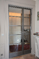 Ménuiserie métallique acier, porte d'intérieure, cloison intérieure, structure acier brut type loft sur mesure, vitrage sécurit, verrière type atelier d'artiste francation francaise profil métallique tres fin type fineline